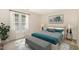 Comfortable bedroom with a queen-sized bed, bench, and bright natural light at 2519 Hitchcock Dr, Durham, NC 27705