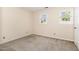 Empty bedroom with carpet, neutral paint, natural light, and two windows at 2519 Hitchcock Dr, Durham, NC 27705