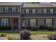 Exterior view of townhomes, highlighting the facade and front yard landscaping at 2519 Hitchcock Dr, Durham, NC 27705