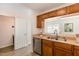 Bright kitchen showcasing ample counter space, stainless steel dishwasher, and open layout at 2519 Hitchcock Dr, Durham, NC 27705