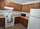 Functional kitchen featuring classic appliances, wood cabinets and laminate countertops at 2519 Hitchcock Dr, Durham, NC 27705