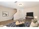 Inviting living room complete with modern furnishings, a cozy rug, and stairs for easy access to other floors at 2519 Hitchcock Dr, Durham, NC 27705