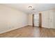 A well lit living room has vinyl flooring and a bright window that gives a cozy feeling at 2519 Hitchcock Dr, Durham, NC 27705