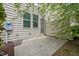 Back patio with wood fence and landscaping at 256 Rubrum Dr, Hillsborough, NC 27278