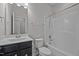 This bathroom has a shower and a single sink vanity with dark cabinets at 256 Rubrum Dr, Hillsborough, NC 27278