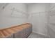 Walk-in closet with wire shelves and a built-in dresser at 256 Rubrum Dr, Hillsborough, NC 27278