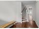 Hallway with wood flooring, a staircase, and a bench at 256 Rubrum Dr, Hillsborough, NC 27278