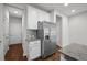 Well-lit kitchen featuring stainless steel appliances, granite countertops, and glass tile backsplash at 256 Rubrum Dr, Hillsborough, NC 27278