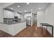 Modern kitchen with white cabinets, stainless steel appliances, and granite countertops at 256 Rubrum Dr, Hillsborough, NC 27278
