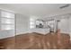 Spacious living room with hardwood floors and built-in shelving units at 256 Rubrum Dr, Hillsborough, NC 27278