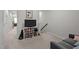 Upstairs area with a TV, bookshelves, and cozy seating at 256 Rubrum Dr, Hillsborough, NC 27278
