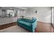 Comfortable living area featuring hardwood floors and a couch with a Wisconsin blanket at 256 Rubrum Dr, Hillsborough, NC 27278