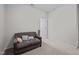 Living room featuring a comfortable couch and neutral decor at 256 Rubrum Dr, Hillsborough, NC 27278