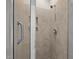 Bathroom shower featuring tile surround and a grab bar at 256 Rubrum Dr, Hillsborough, NC 27278