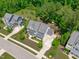 Aerial shot revealing a landscaped home with mature trees and a well-manicured lawn at 2711 Jordan Pointe Blvd, New Hill, NC 27562