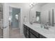 Bright bathroom with double sinks and view to bedroom through doorways at 2711 Jordan Pointe Blvd, New Hill, NC 27562