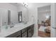 Bright bathroom features a double vanity and an open doorway to the main bedroom at 2711 Jordan Pointe Blvd, New Hill, NC 27562