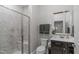 Neutral-toned bathroom with a tiled shower, modern fixtures, and a framed mirror at 2711 Jordan Pointe Blvd, New Hill, NC 27562