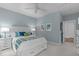 Comfortable bedroom with a bed, two windows, and nightstands at 2711 Jordan Pointe Blvd, New Hill, NC 27562