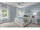 Comfortable bedroom with two windows, a ceiling fan, and nightstands at 2711 Jordan Pointe Blvd, New Hill, NC 27562