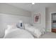 Bright bedroom with two beds, a nightstand, and artwork adorning the wall at 2711 Jordan Pointe Blvd, New Hill, NC 27562