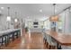 Kitchen island with breakfast bar open to living room and dining room at 2711 Jordan Pointe Blvd, New Hill, NC 27562