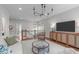 Stylish upstairs living room with wood floors, modern furniture, and lots of natural light at 2711 Jordan Pointe Blvd, New Hill, NC 27562