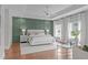Spacious main bedroom with tray ceiling, accent wall, and large windows with lots of light at 2711 Jordan Pointe Blvd, New Hill, NC 27562