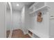 Mudroom area with storage shelves, hooks, a bench and access to a closet at 2711 Jordan Pointe Blvd, New Hill, NC 27562