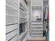 Bright walk-in closet with custom shelving, drawers, and ample storage space at 2711 Jordan Pointe Blvd, New Hill, NC 27562