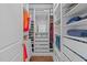 Bright walk-in closet with custom shelving, drawers, and ample storage space at 2711 Jordan Pointe Blvd, New Hill, NC 27562