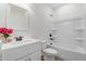 Bathroom with white cabinets, sink, mirror, toilet, and shower-tub combo at 295 Rudd Rd, Youngsville, NC 27596