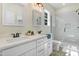 Bathroom featuring double sinks, modern fixtures, and a walk-in shower with glass door at 295 Rudd Rd, Youngsville, NC 27596