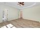 Large bedroom with a ceiling fan, access to an ensuite bathroom, and ample natural light at 295 Rudd Rd, Youngsville, NC 27596
