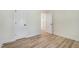 Bright empty bedroom with neutral walls, and closet with plank flooring at 295 Rudd Rd, Youngsville, NC 27596