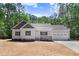 Charming single-Gathering home featuring an attached two-car garage and manicured lawn at 295 Rudd Rd, Youngsville, NC 27596