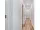 Bright hallway with clean lines and wood-look flooring, connecting various rooms at 295 Rudd Rd, Youngsville, NC 27596