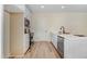 A well-lit kitchen featuring modern appliances, white cabinetry, and sleek countertops at 295 Rudd Rd, Youngsville, NC 27596