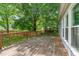 Back deck extending along the back of the home with the yard in view at 3 Cobble Glen Ct, Durham, NC 27713