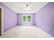 Bedroom featuring bright purple walls, carpet floors, and a ceiling fan at 3 Cobble Glen Ct, Durham, NC 27713