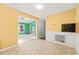 Dining area with wainscotting and an open doorway leading into the adjacent living room at 3 Cobble Glen Ct, Durham, NC 27713