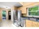 Charming kitchen featuring honey oak cabinets, stainless steel appliances and light filled window at 3 Cobble Glen Ct, Durham, NC 27713