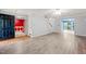 Open-concept living room showcasing wood-look flooring, and an open floor plan at 3 Cobble Glen Ct, Durham, NC 27713