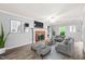 Spacious living room with a cozy fireplace and modern furnishings at 3 Cobble Glen Ct, Durham, NC 27713