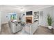 Bright living room featuring a fireplace and elegant gray furnishings at 3 Cobble Glen Ct, Durham, NC 27713