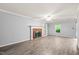 Inviting living room with brick fireplace, built-in shelving, and neutral wall colors at 3 Cobble Glen Ct, Durham, NC 27713