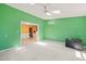 Open-concept living room with bright green walls at 3 Cobble Glen Ct, Durham, NC 27713