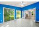 Sunroom with white tile floors and lots of natural light at 3 Cobble Glen Ct, Durham, NC 27713