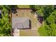 Aerial view of home showing the roof, fence line, and proximity to trees at 3003 University Dr, Durham, NC 27707