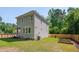 Wide shot of backyard with new fence and garden beds at 3003 University Dr, Durham, NC 27707